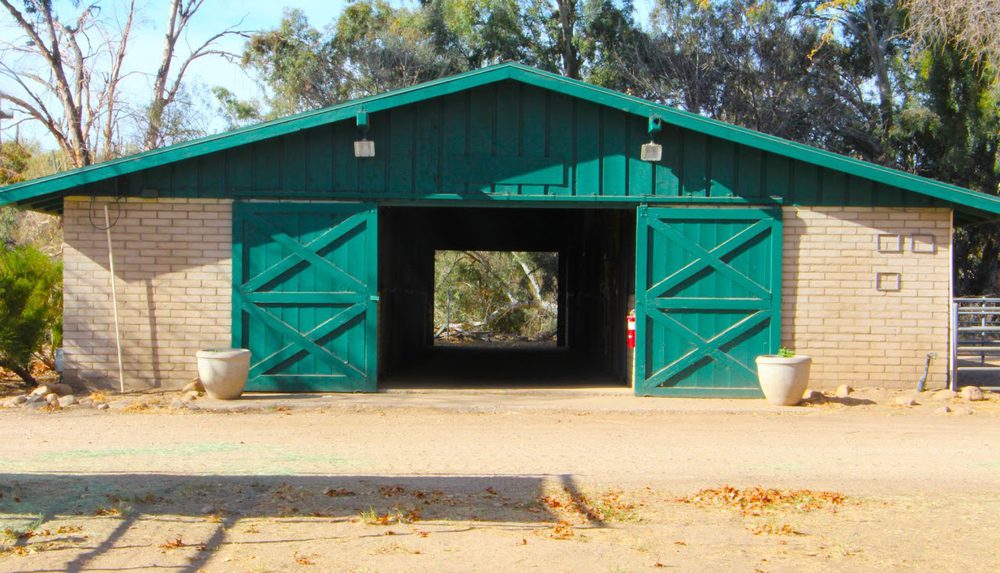 A green-doored barn